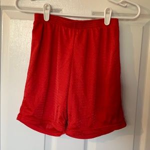 Red CHAMPION midi shorts